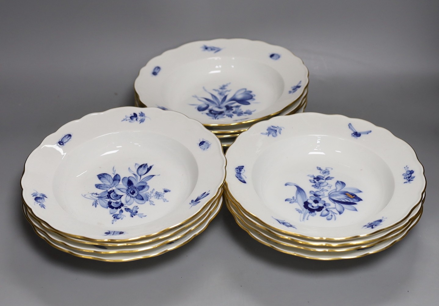A set of twelve floral blue and white Meissen porcelain plates, early 20th century, 24cms diameter.